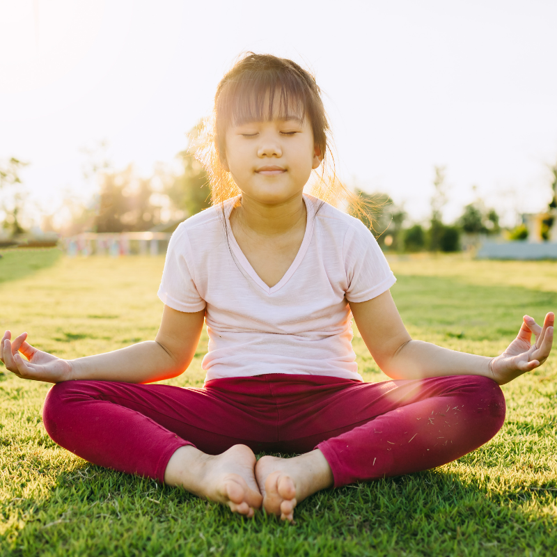 Child doing buttefly pose to help calm them.