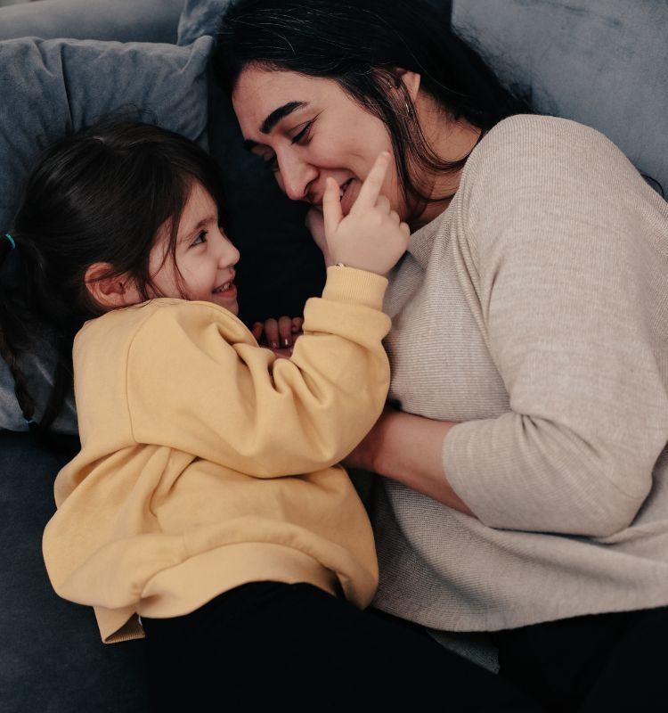 Nervous System Co-regulation moment between parent and child. Learn more about parenting from a place of a balanced nervous system at www.shineom.com.au