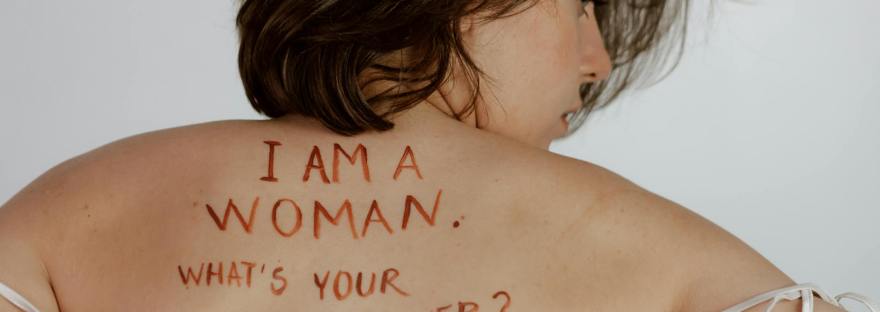 A woman with the words I am a woman what's your superpower? Learn more about how women can create and birth the life they desire when living in their feminine essence. Read more at https://shineom.com.au/birthing-in-the-feminine-way-for-mothers